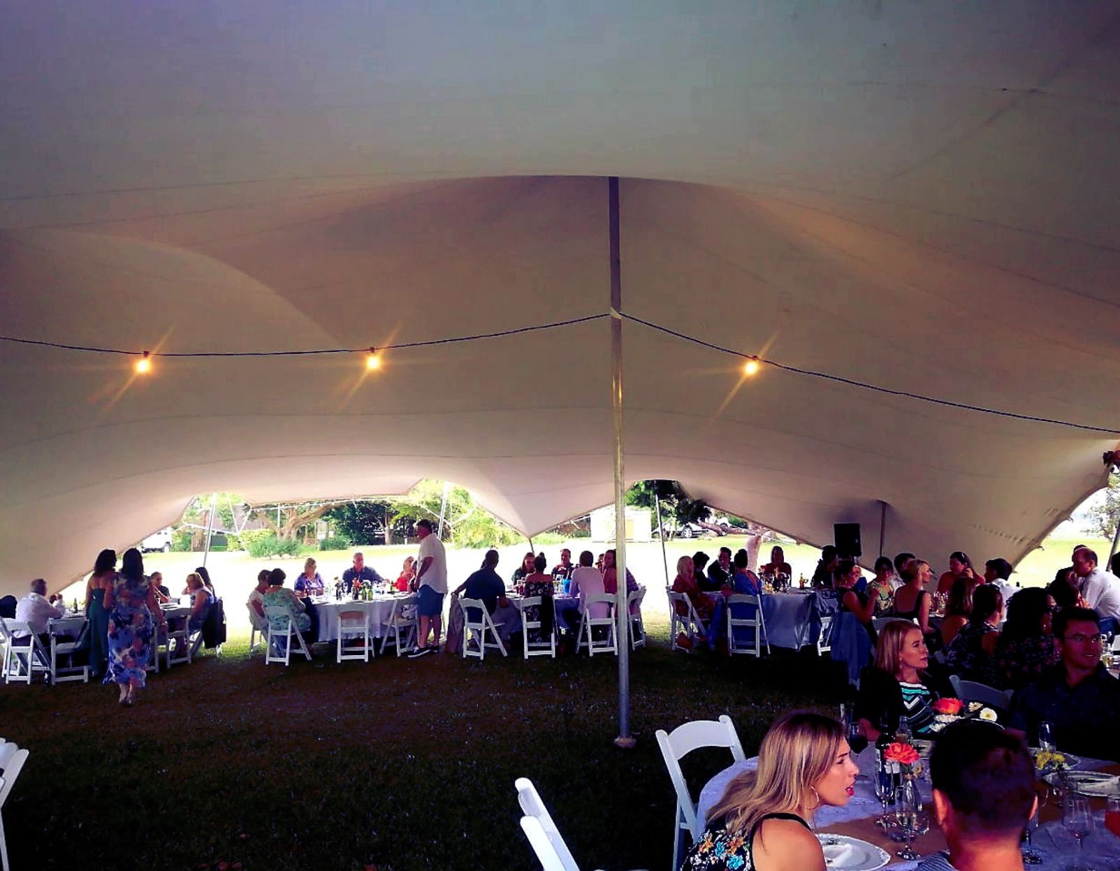 Wedding Reception In A White Stretch Tent With Lights.