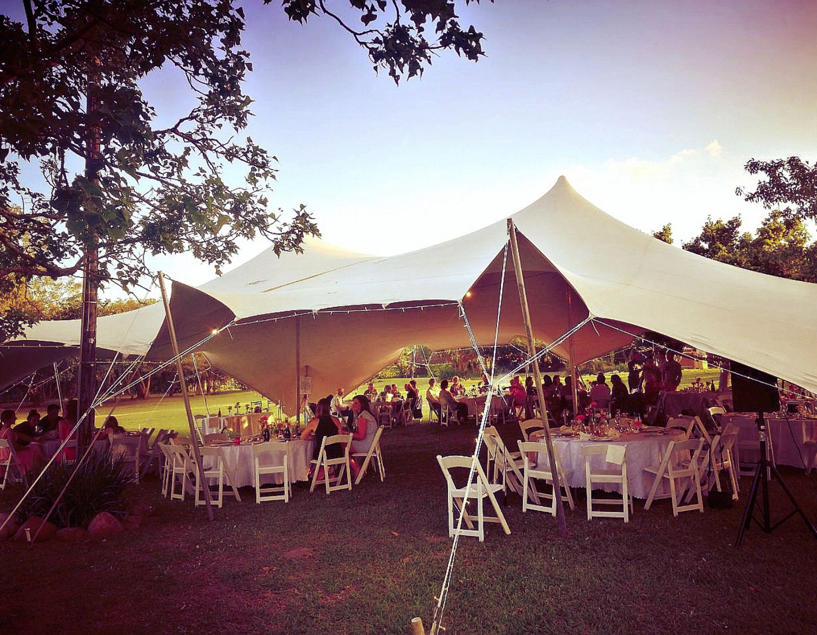 White Nomadic Tent And Furniture Used For A Garden Wedding.